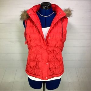 SO brand puffy vest with detachable fuzzy hood.